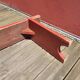 Banc ancien en bois peint en rouge