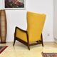 Yellow boucle wingback chair with folding footstool, 1950s