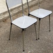 2 beige Formica and steel chairs from the 1980s.