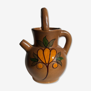 Stoneware ball pitcher with brown floral motifs