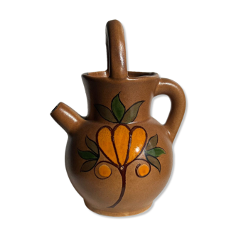 Stoneware ball pitcher with brown floral motifs