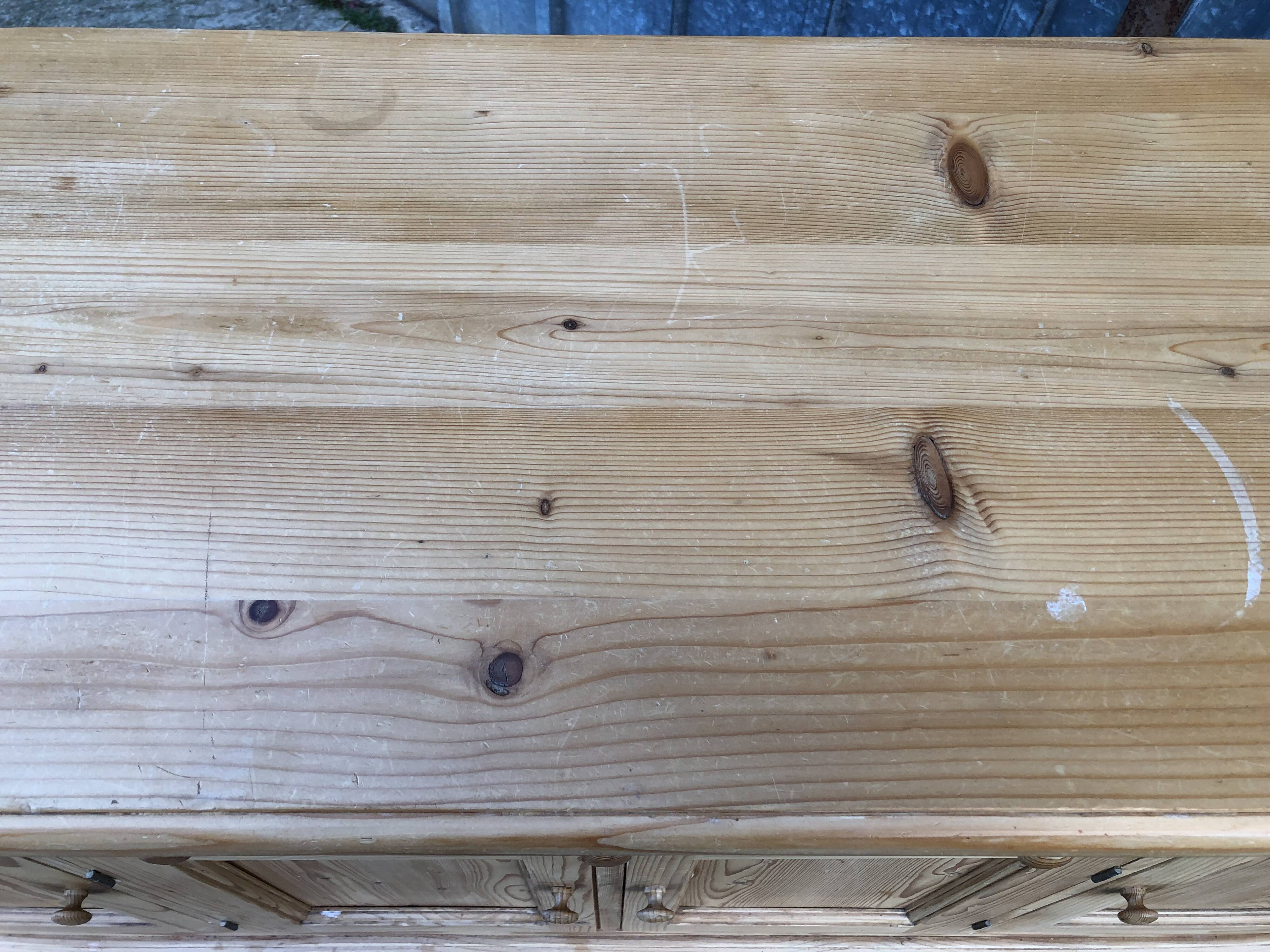 Scandinavian natural pine sideboard with 4 doors and 6 drawers.