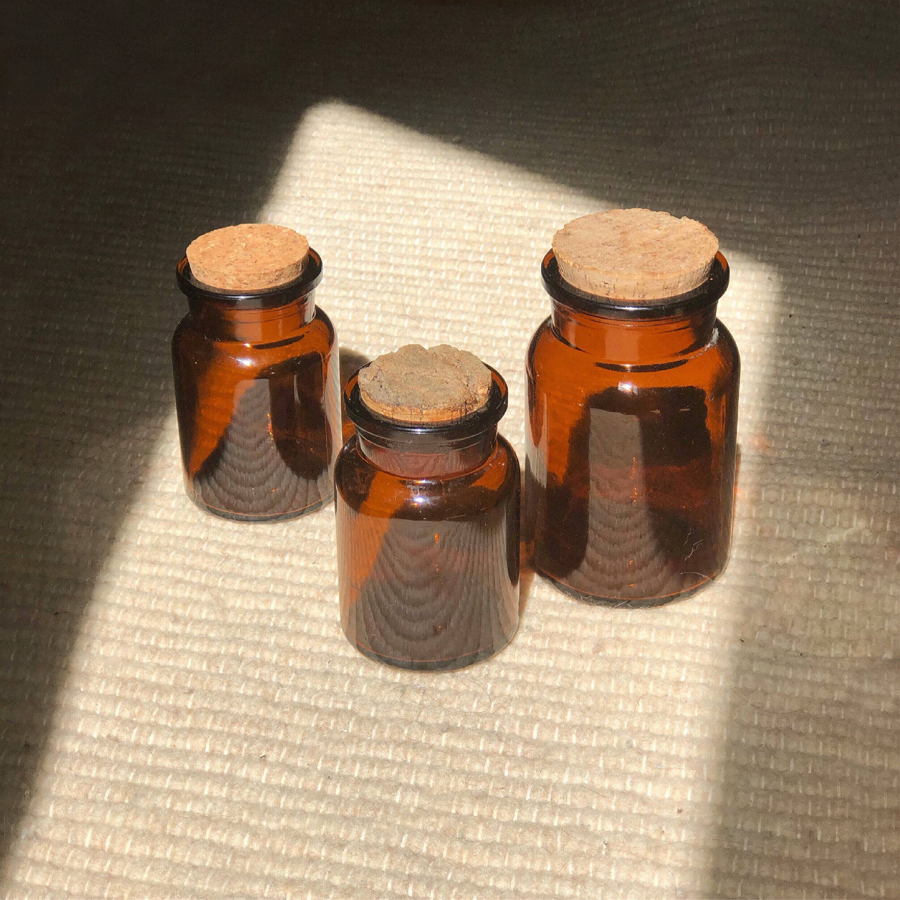 Three amber vintage jars