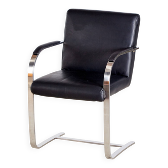 Steel armchair with leather upholstery
