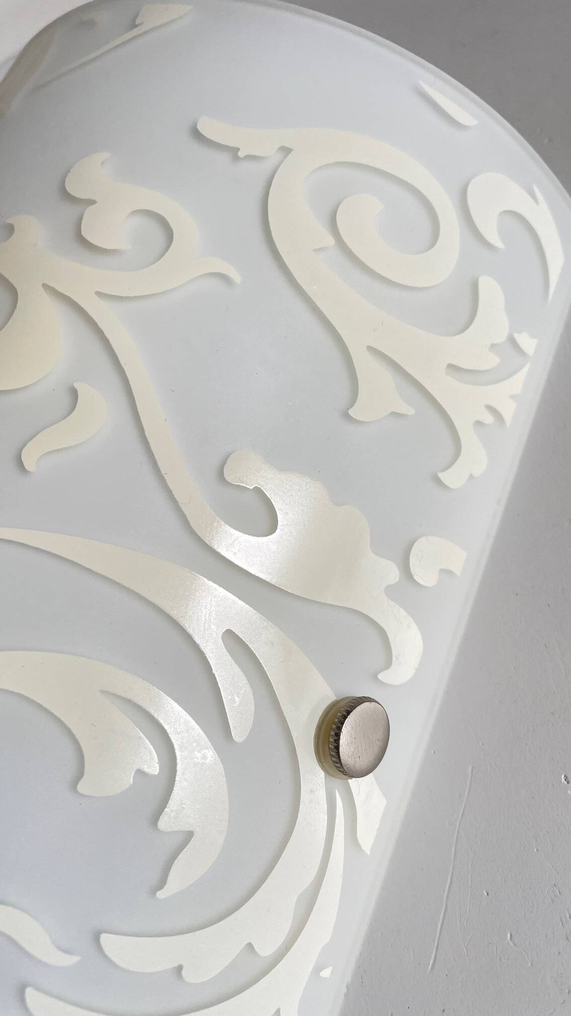 Polished and screen-printed glass sconce by eglo