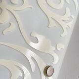 Polished and screen-printed glass sconce by eglo