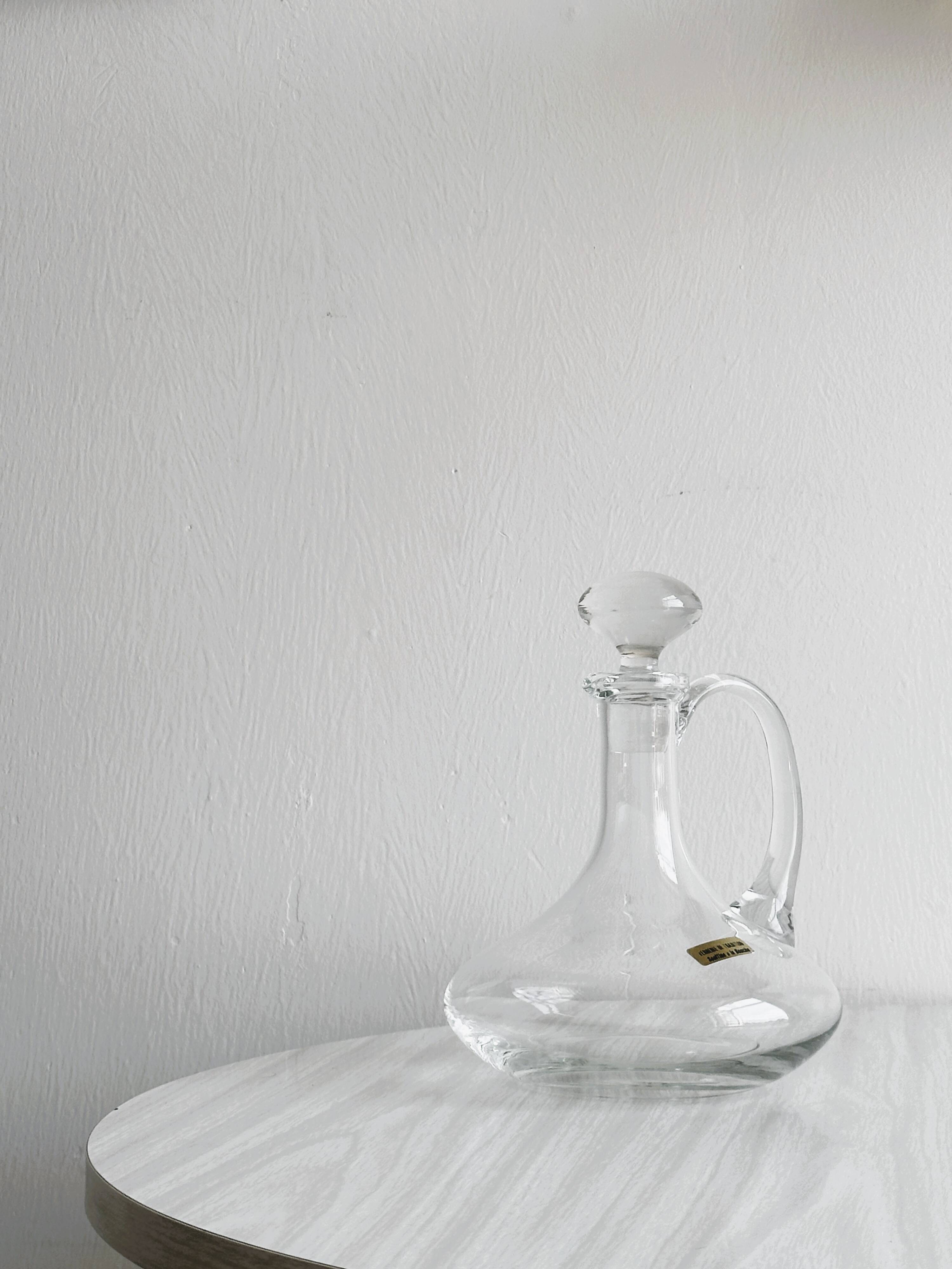 Mouth-blown glass carafe, old glassware.
