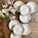 Set of 8 vintage white and gold dessert plates.