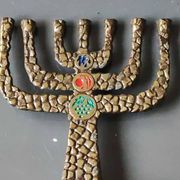 Menorah/Candlestick with 7 light arms. In old gold patinated brass/Decor 12 astrological signs. Engraved Jerusalem. Height 14 cm