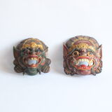 Two polychrome painted and gold leaf gilded Barong dance masks from Bali, Indonesia.