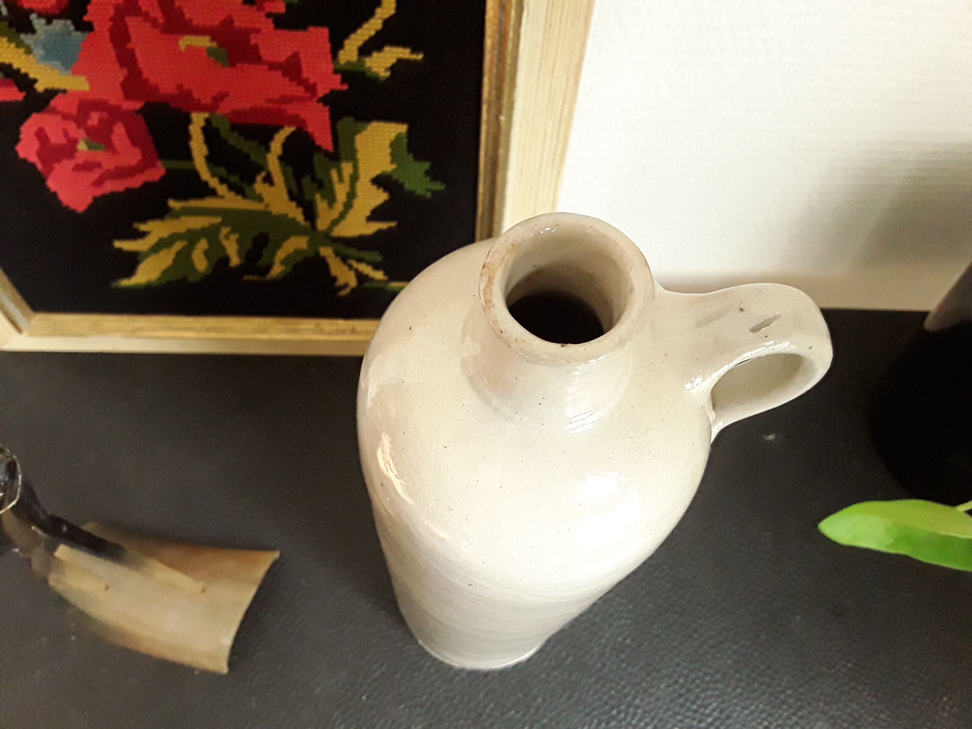 Vintage glazed stoneware bottle with handle