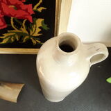 Vintage glazed stoneware bottle with handle