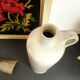 Vintage glazed stoneware bottle with handle