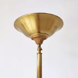 Halogen floor lamp in golden brass