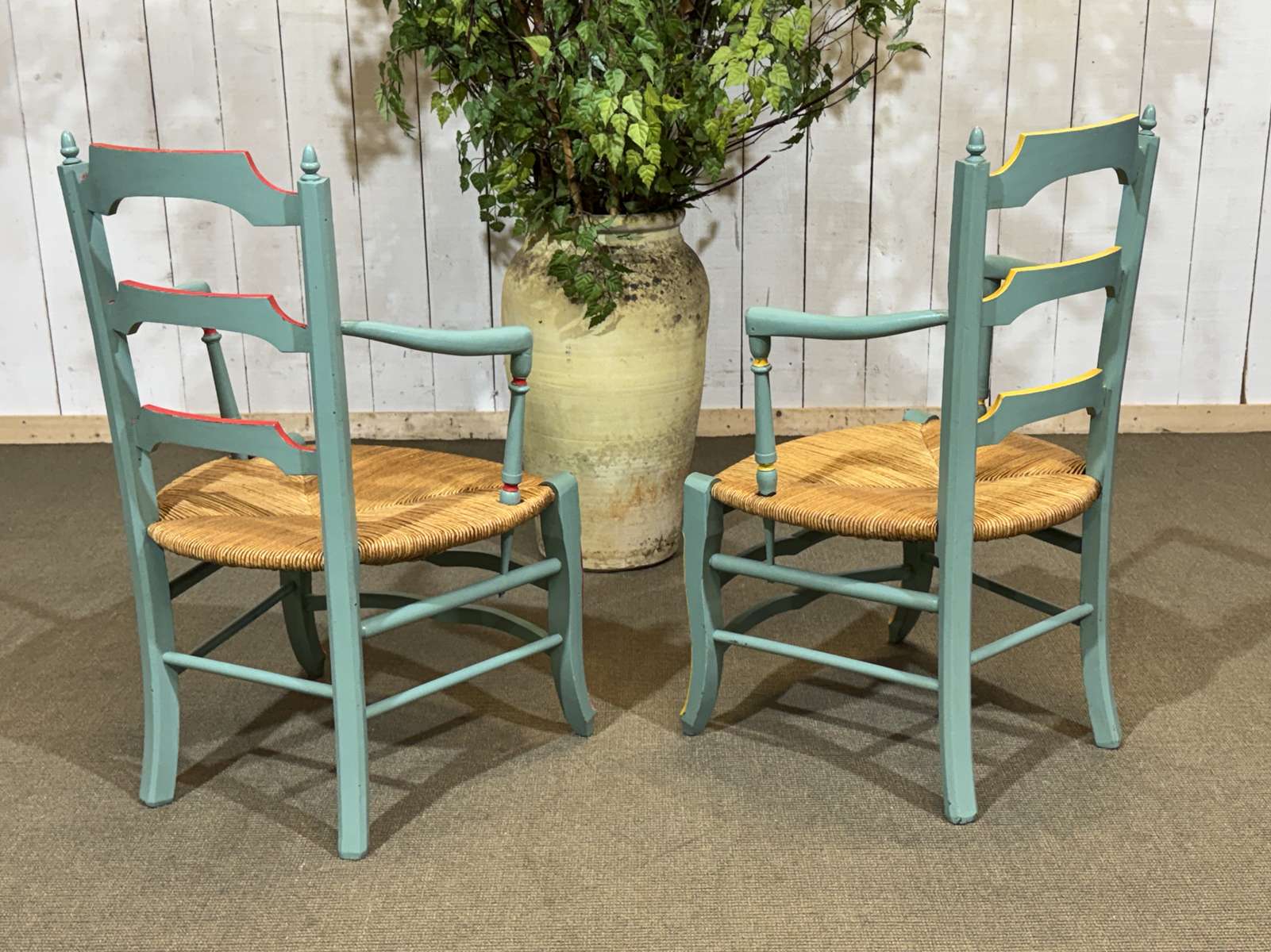 Pair of rustic armchairs in beech with straw seats.