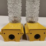 Bathroom lamps in a nice yellow colour with a crystal glass shade and a base of hard thin plastic