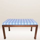 Ottoman coffee table in wood and gingham fabric.