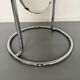 Large freestanding chrome metal full-length mirror in 1970s design.