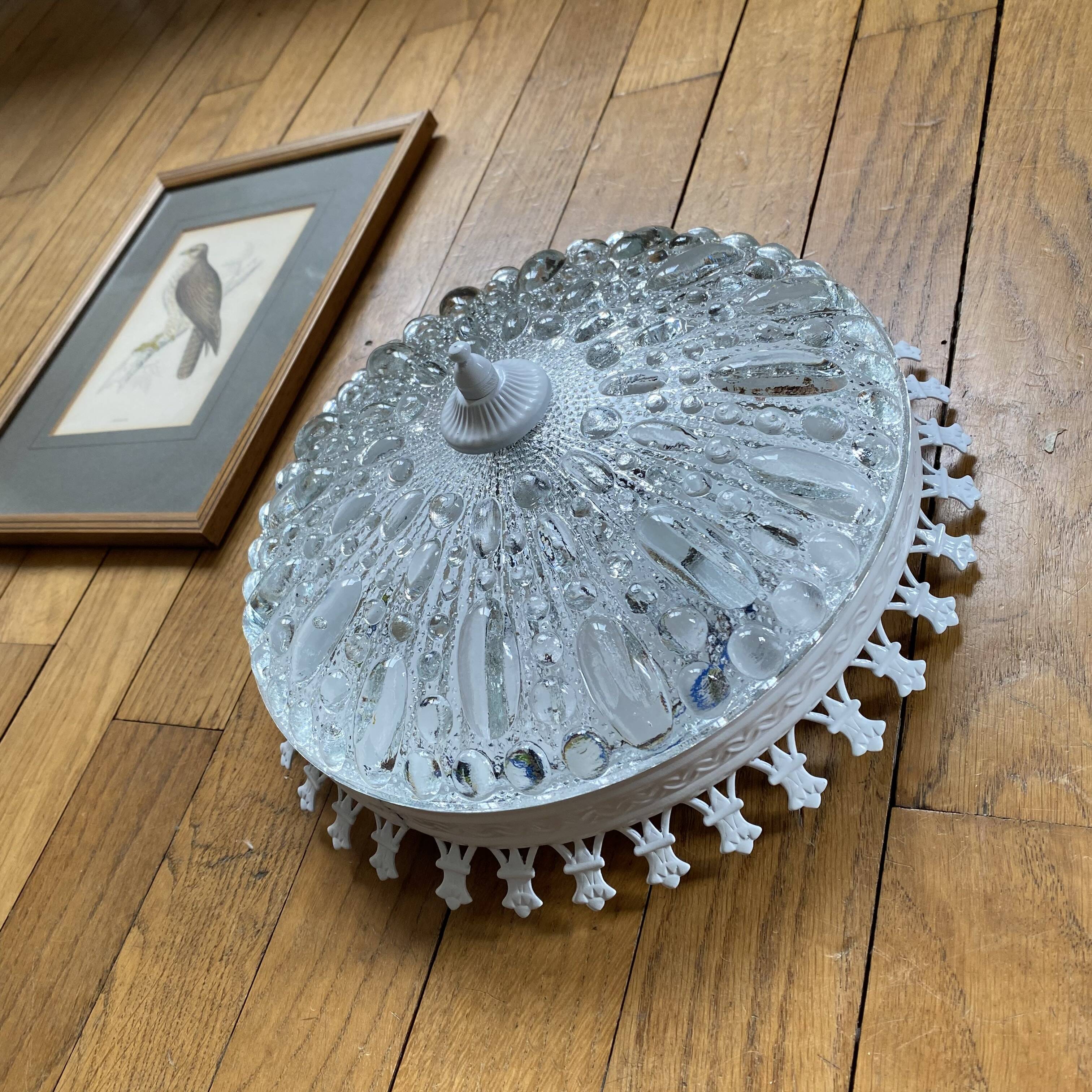 Antique ceiling light with transparent glass and white metal.