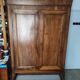 Old walnut wood cabinet with hat and 2 drawer doors