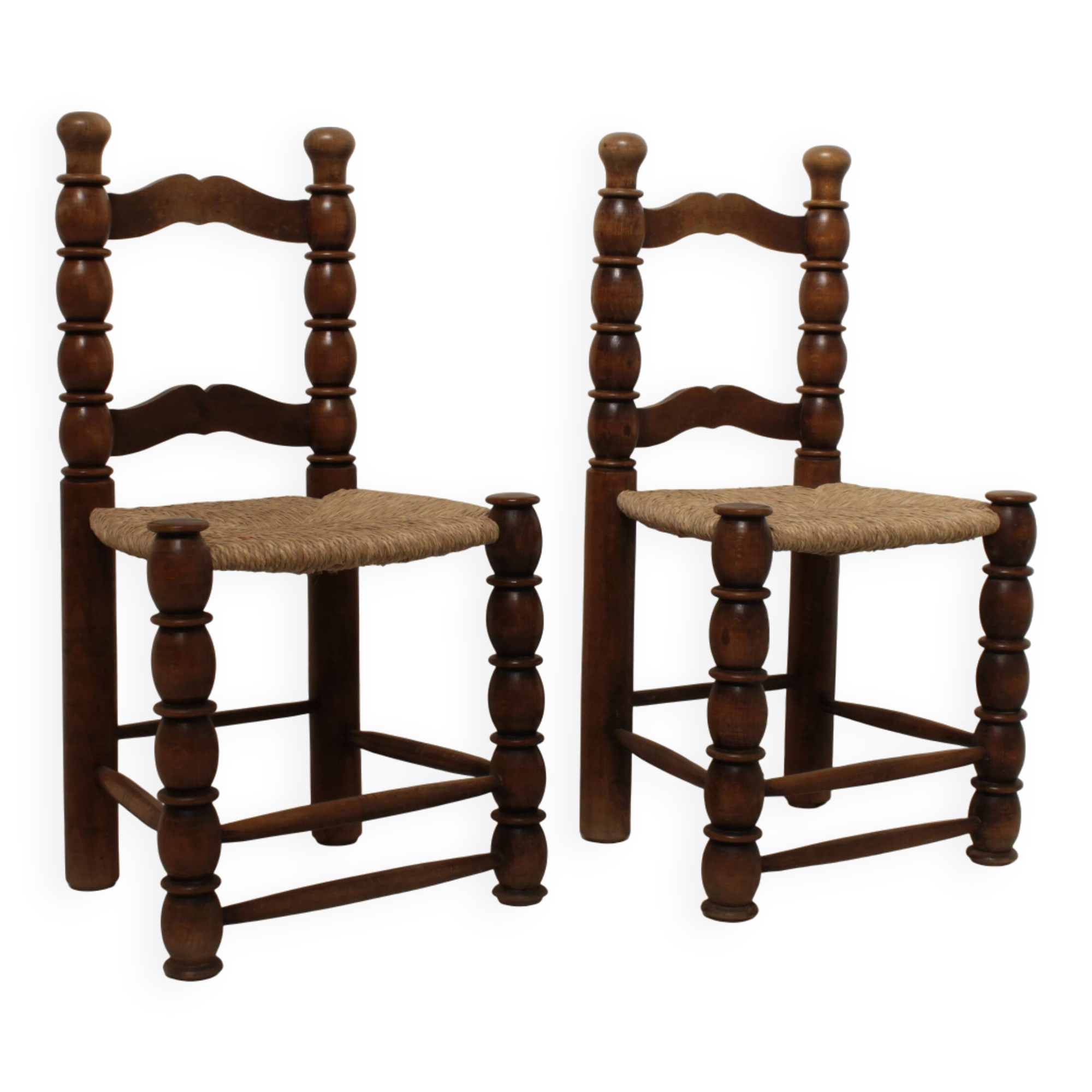 Pair of rustic chairs in turned wood with straw seats