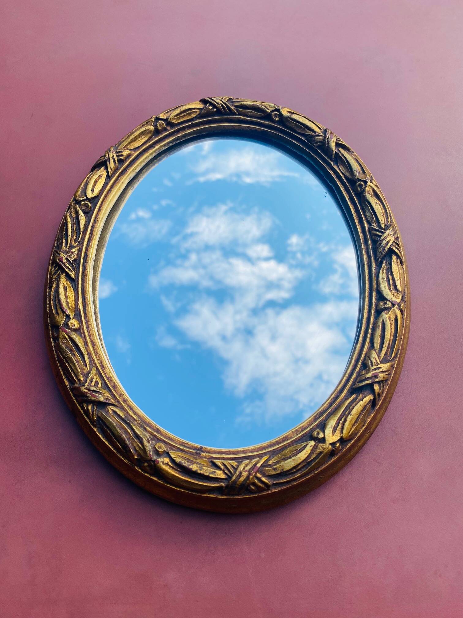 Small antique oval gilt mirror