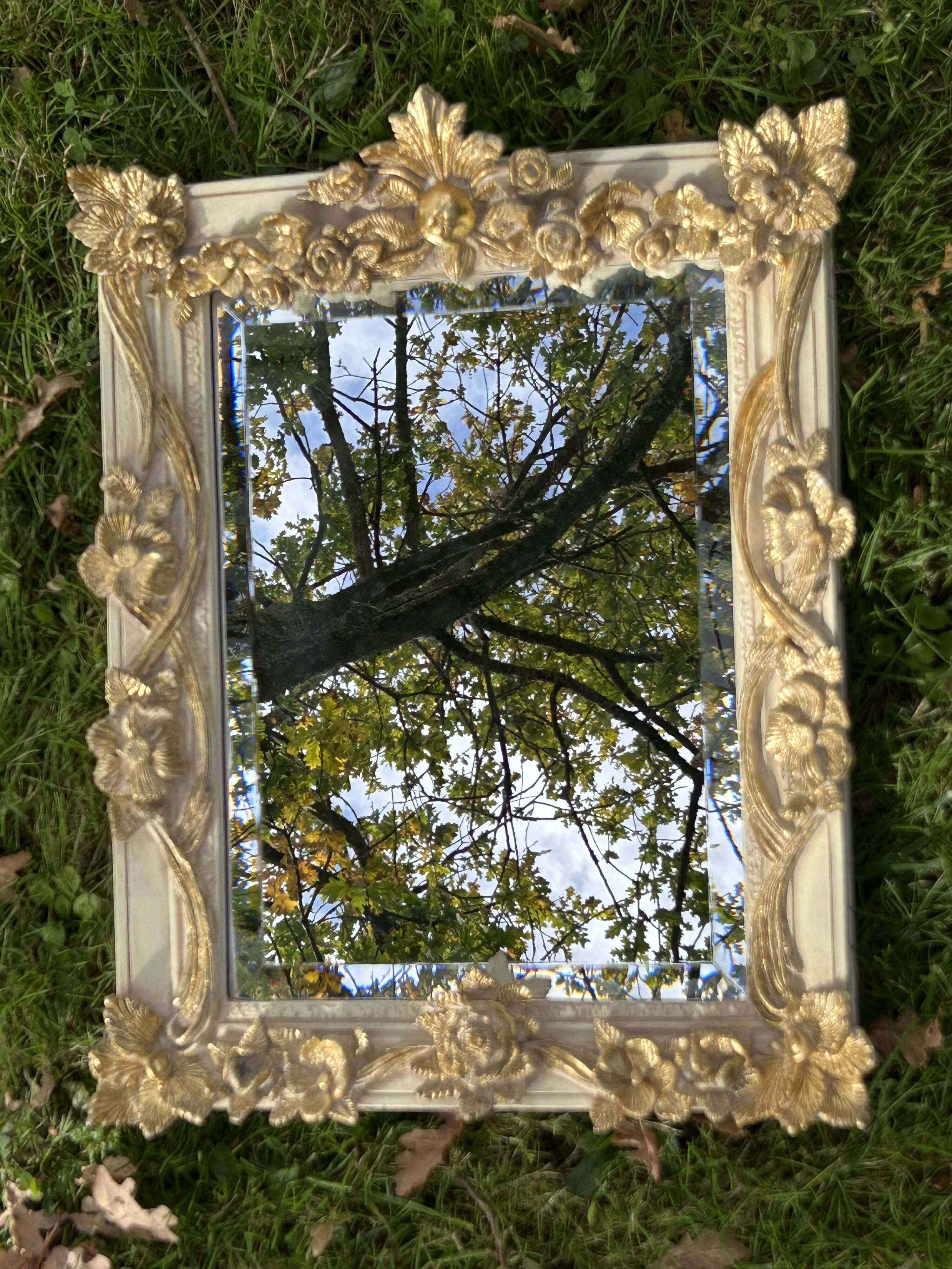 19th century style beveled mirror with garlands of flowers and leaves