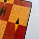 Vintage coffee table in laminate with geometric design, with tapered legs.