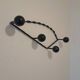 Antique design wall hook in wrought iron and painted wood.
