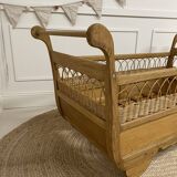 Wooden and rattan baby bed