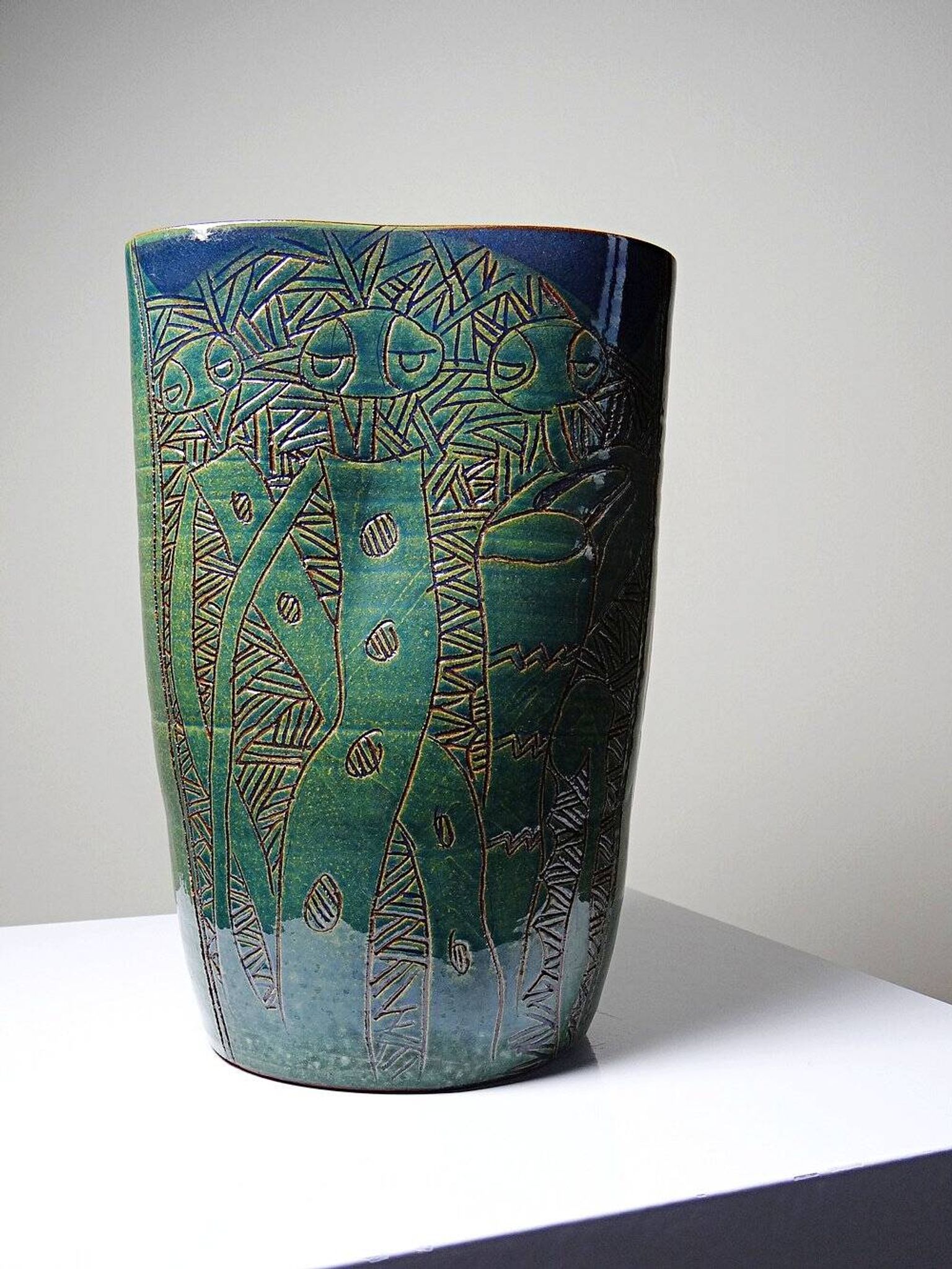 Vintage blue-green handcrafted pottery vase with incised tribal design by Eseka Pottery