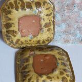 Set of three potter's plates in enamelled earth