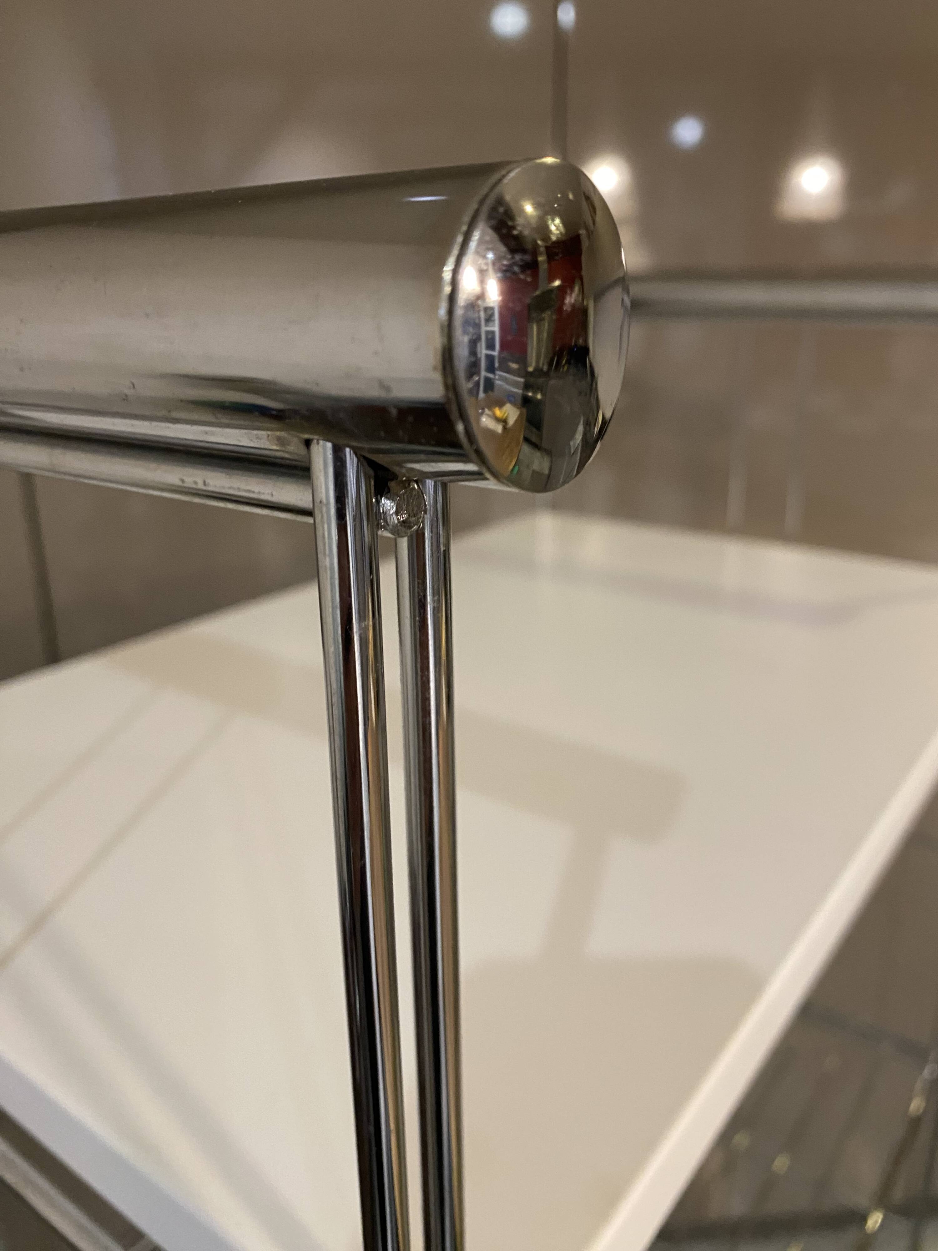 Modular wall bookshelf desk in vintage chrome.