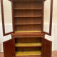 English showcase in two mahogany bodies and 19th century veneer
