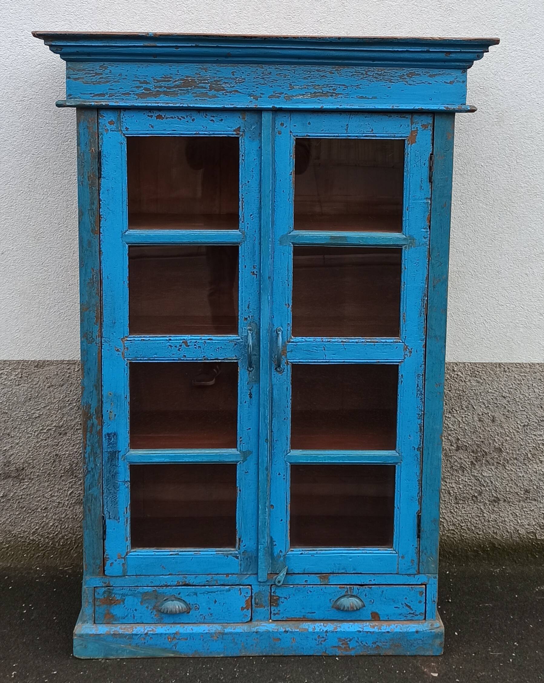 Old wooden glazed cabinet with two doors and two drawers