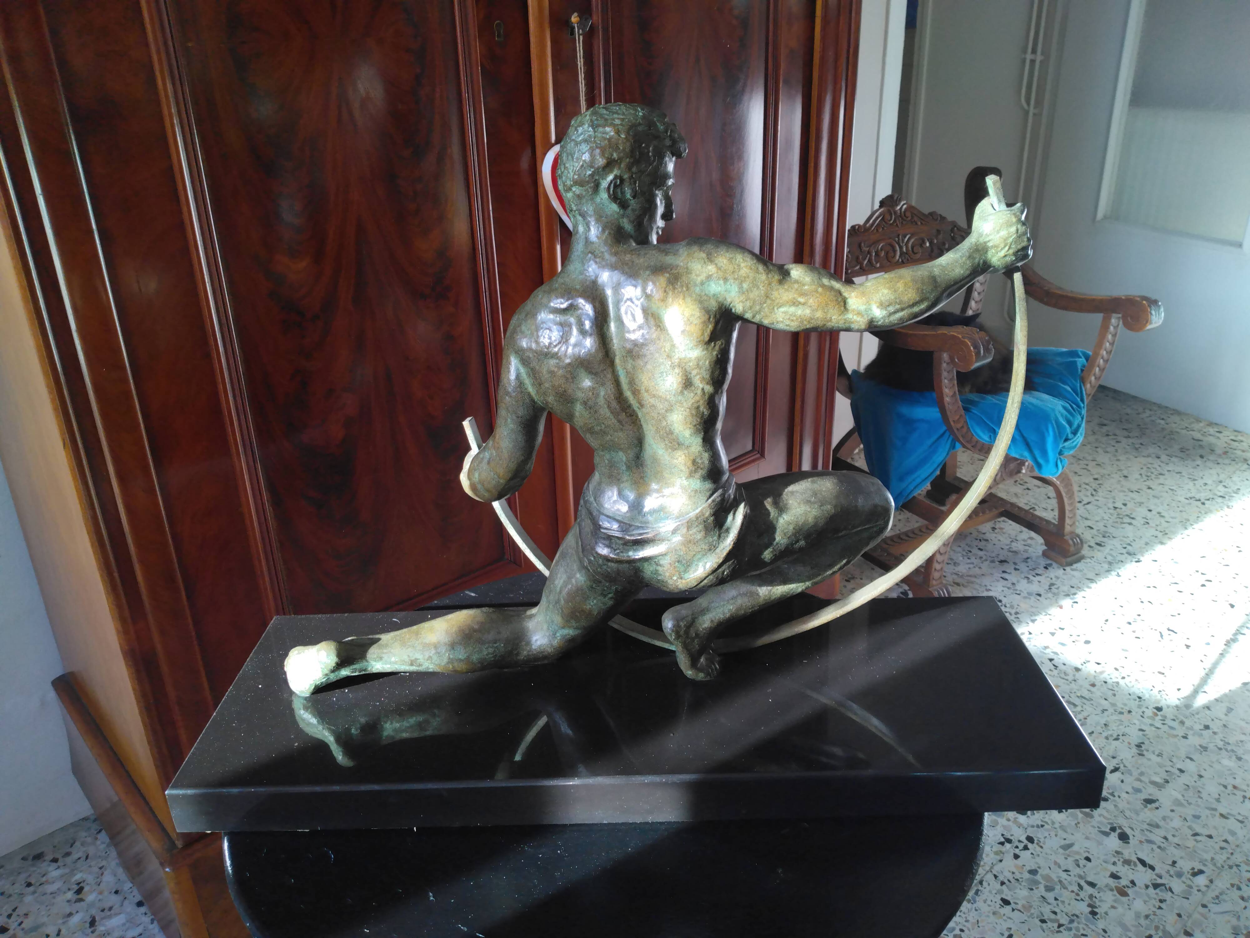 bronze sculpture athlete bending an iron bar by Jean de Roncourt on an art deco marble base