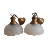 Pair of frosted glass flower pendant lights with vintage wood and brass