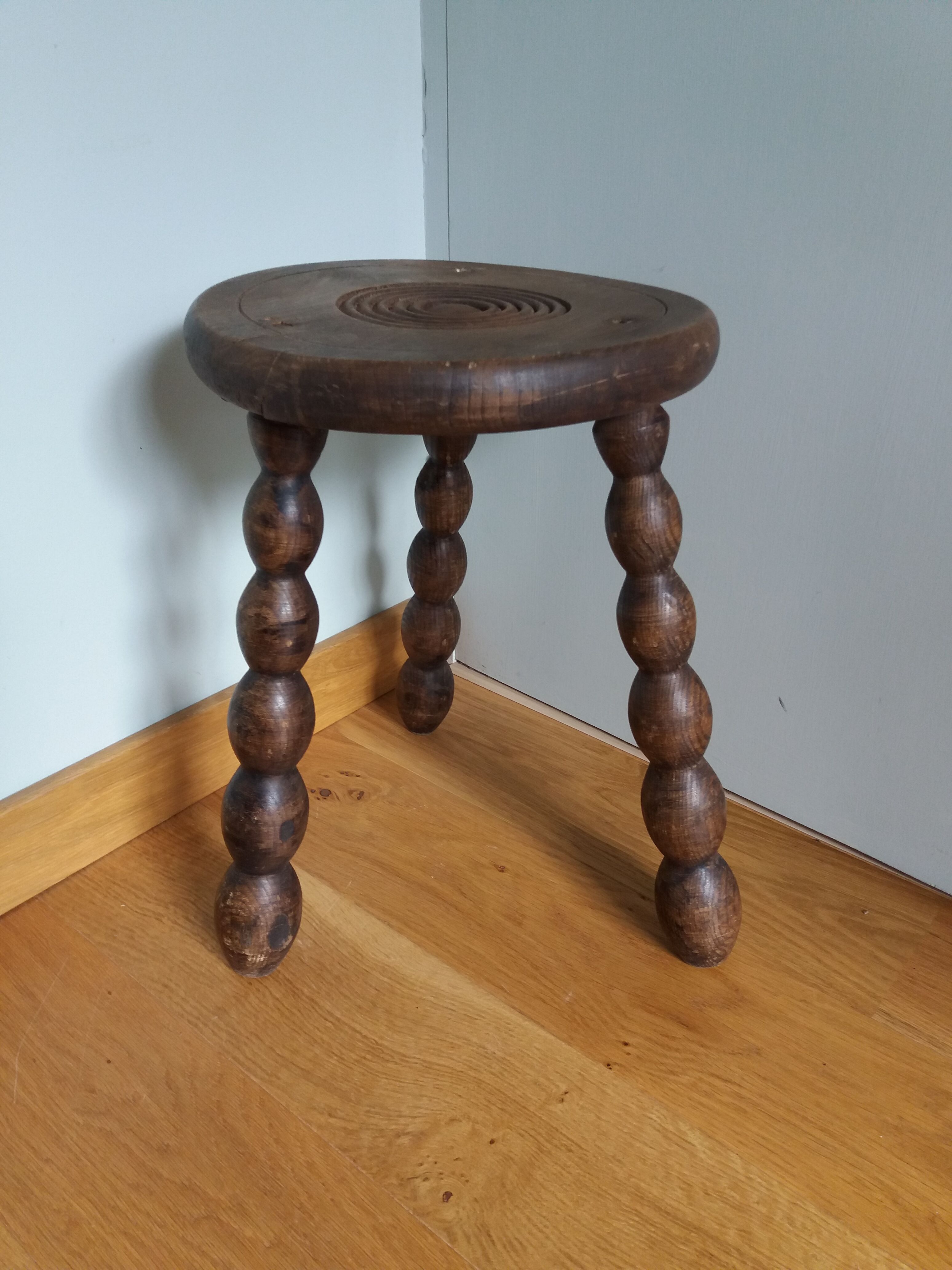 Tripod stool in wood turned coil way