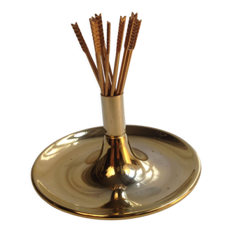 Cocktail spikes - aperitif depicting golden metal arrows