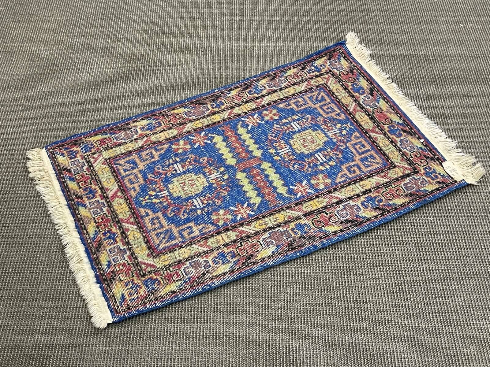 Small handmade wool Iranian rug.