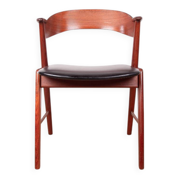 Danish armchair in teak and Skai, by Henning Kjaernulf for Korup Stolefabr.