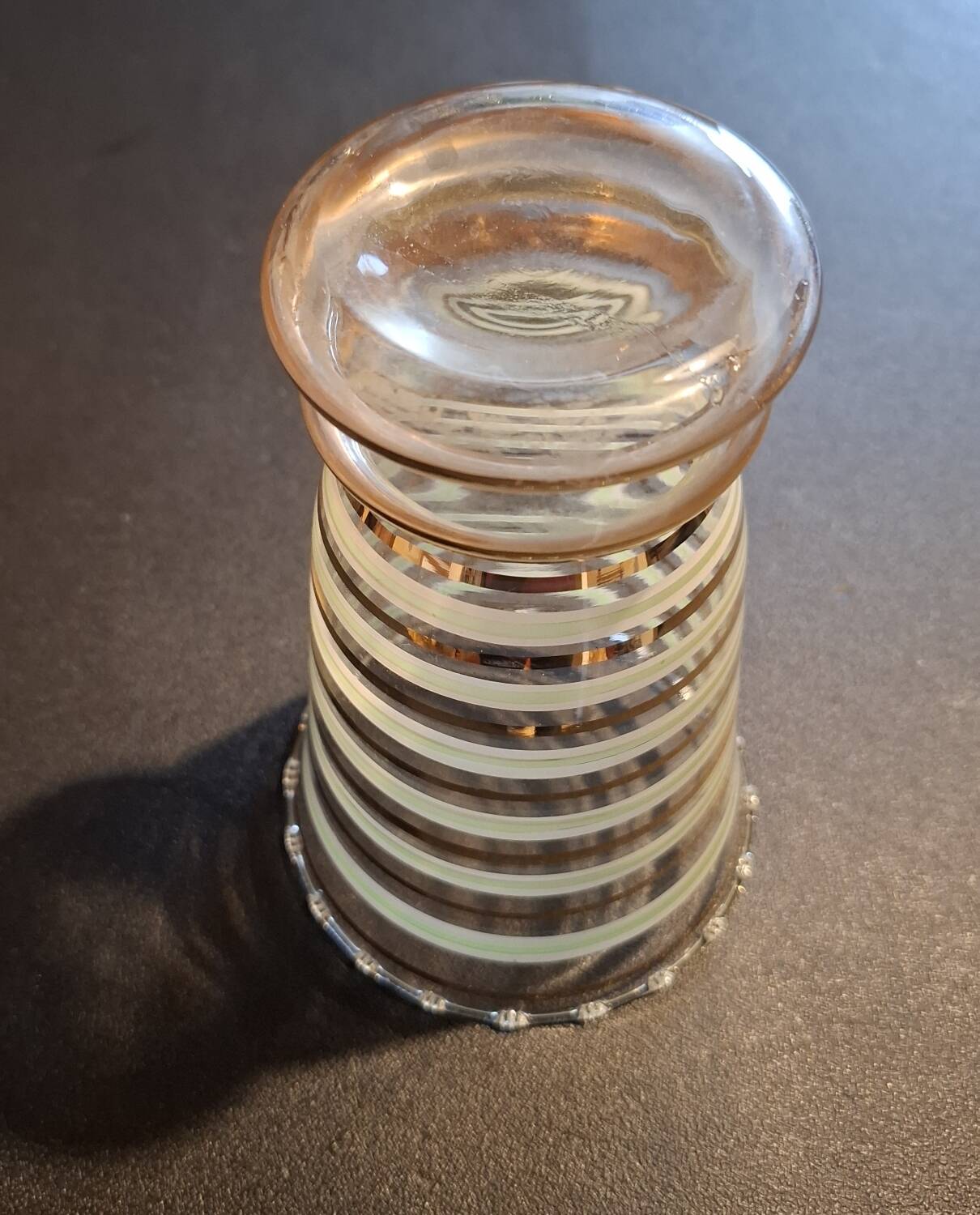 Vintage vase with green and gold trim.