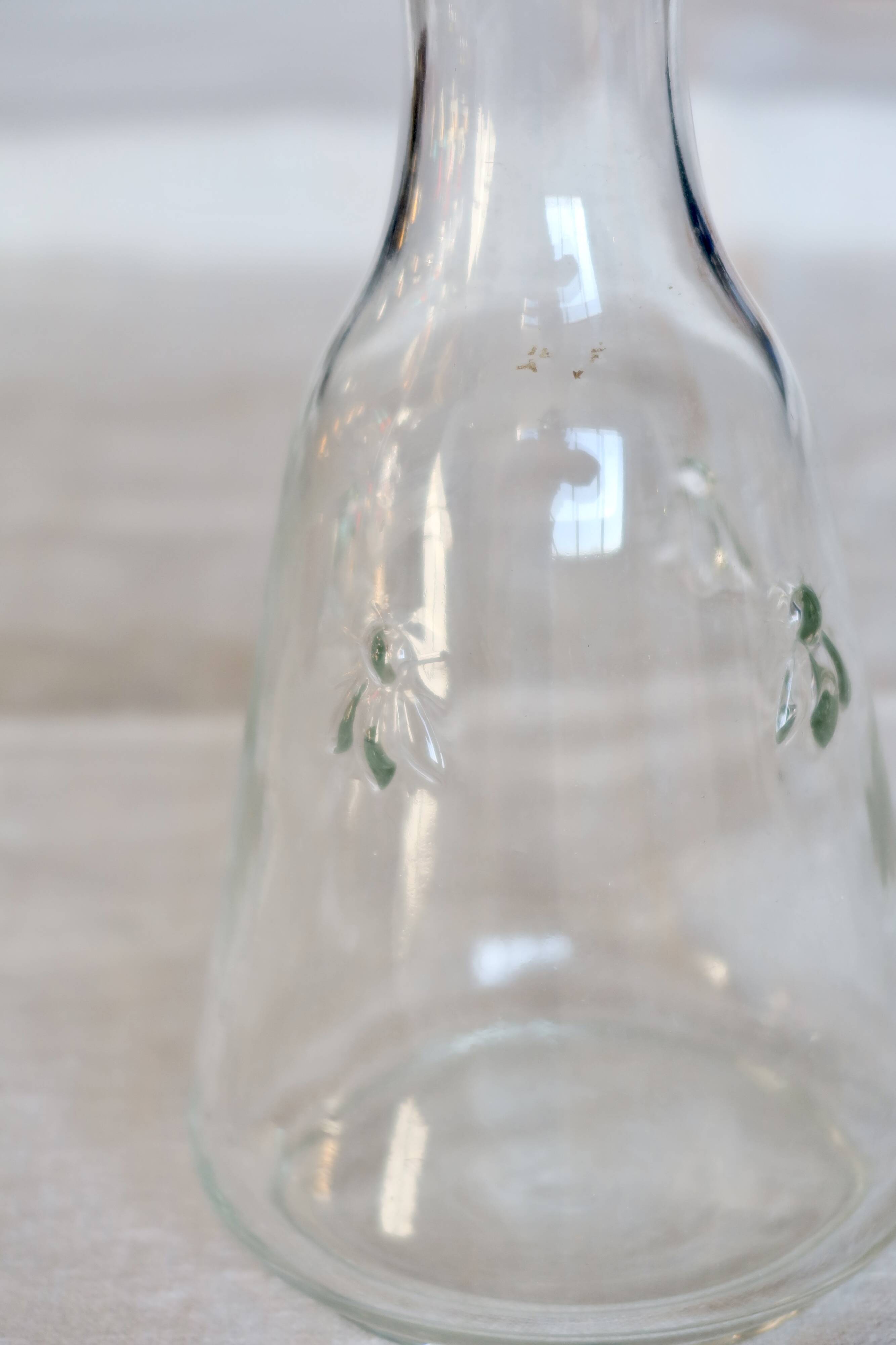 Vintage glass carafe with embossed bee motifs