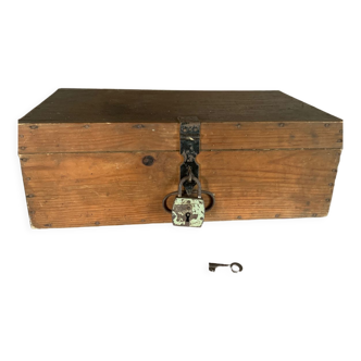 Wooden chest with antique padlock