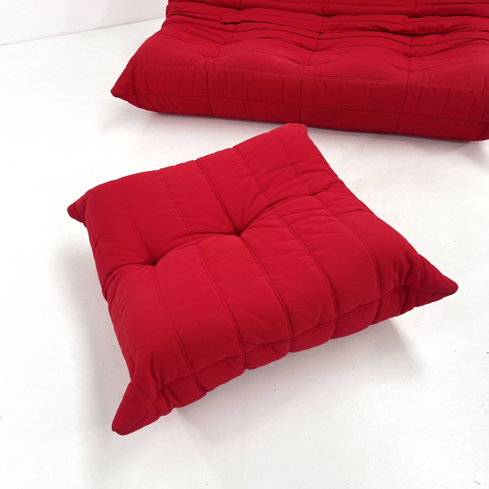 Togo 3-seater with red ottoman by Michel Ducaroy for Ligne Roset, 1970.