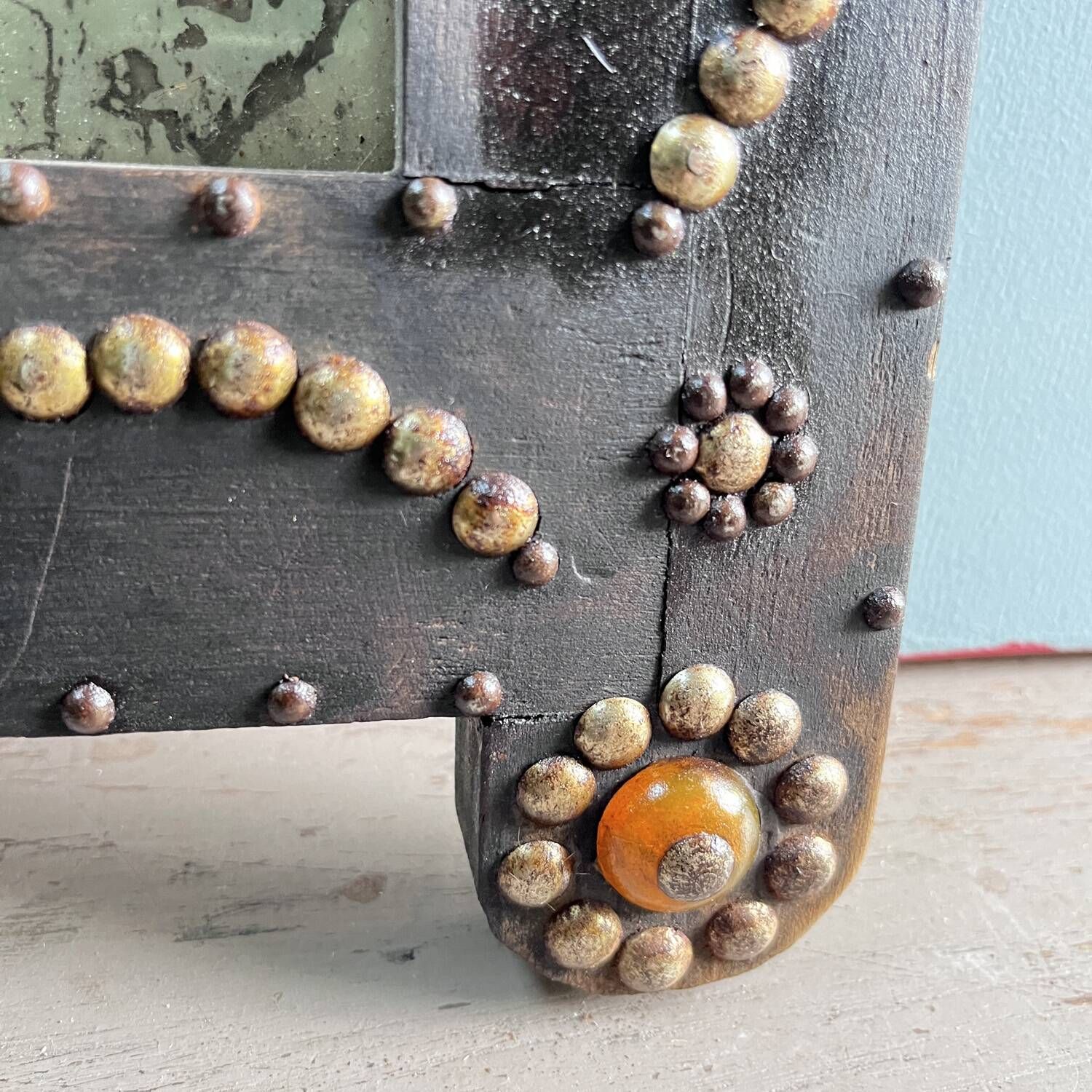 Antique wooden studded mirror