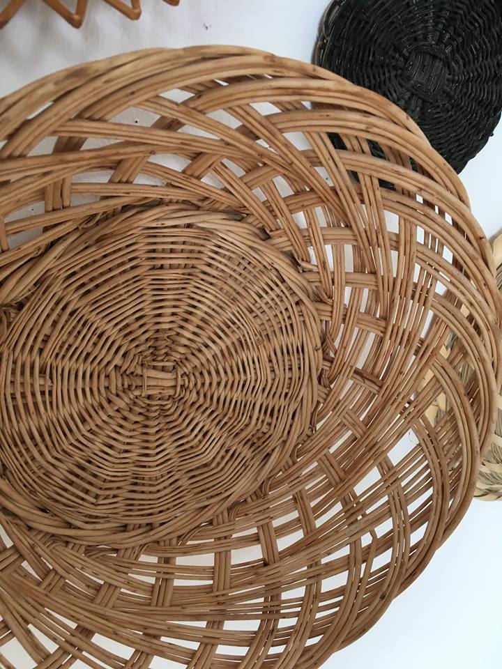 Wall composition of seven baskets and wicker trays