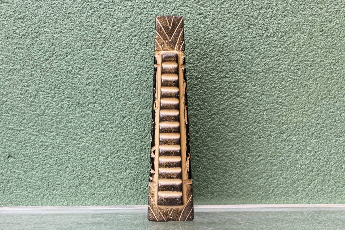 Modernist ceramic vase, signed, with incised geometric tribal decoration.