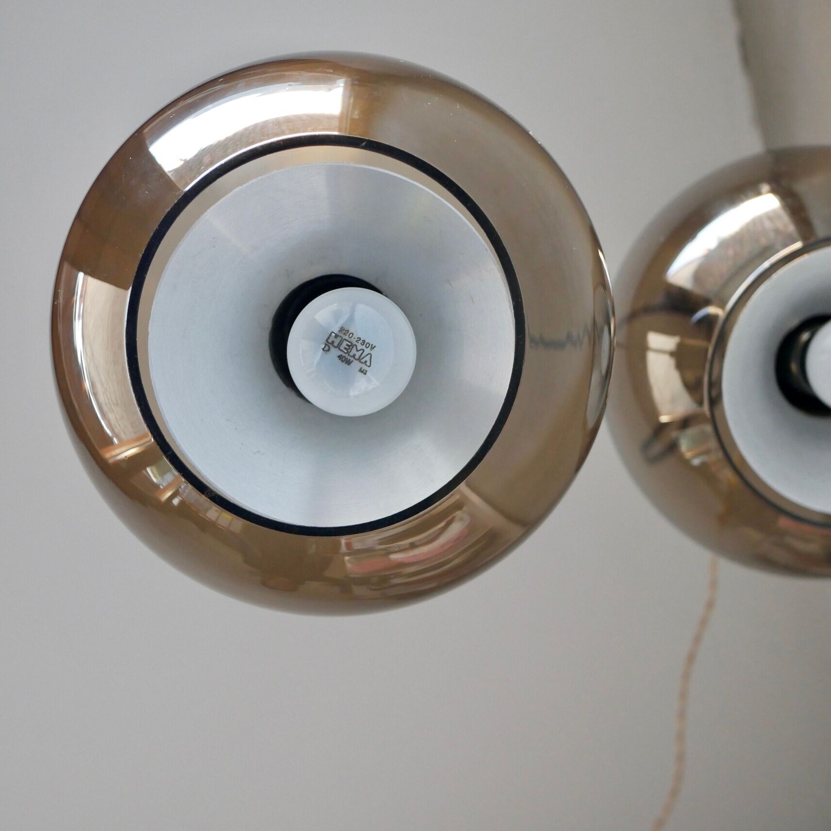 Pair of raak Amsterdam globe suspensions