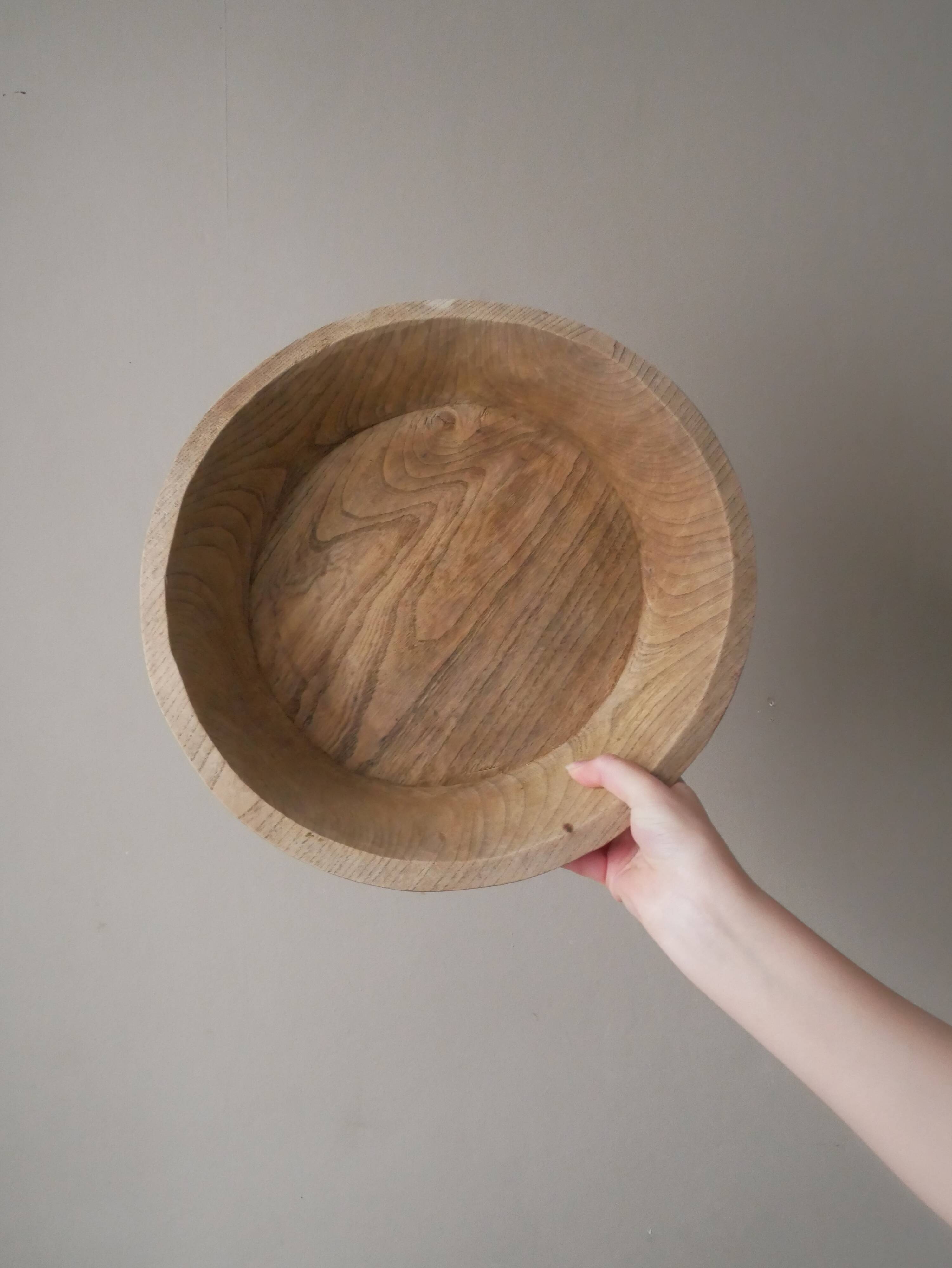 Raw wooden dish carved in the mass ethnic African art handmade artisanal manufacturing